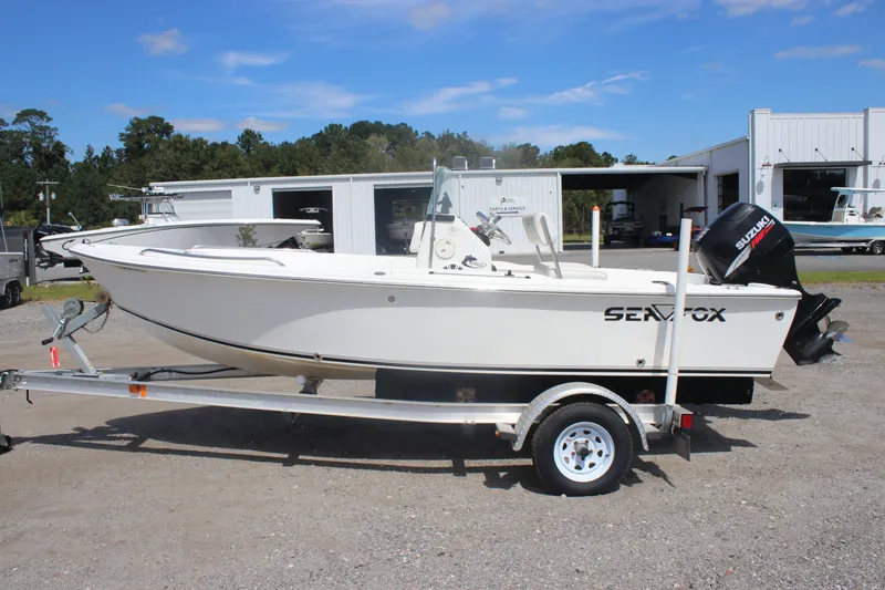 Slide: The Image of 2007 Sea Fox 172 Center Console boat on trailer, parked outdoors near service buildings. - 9