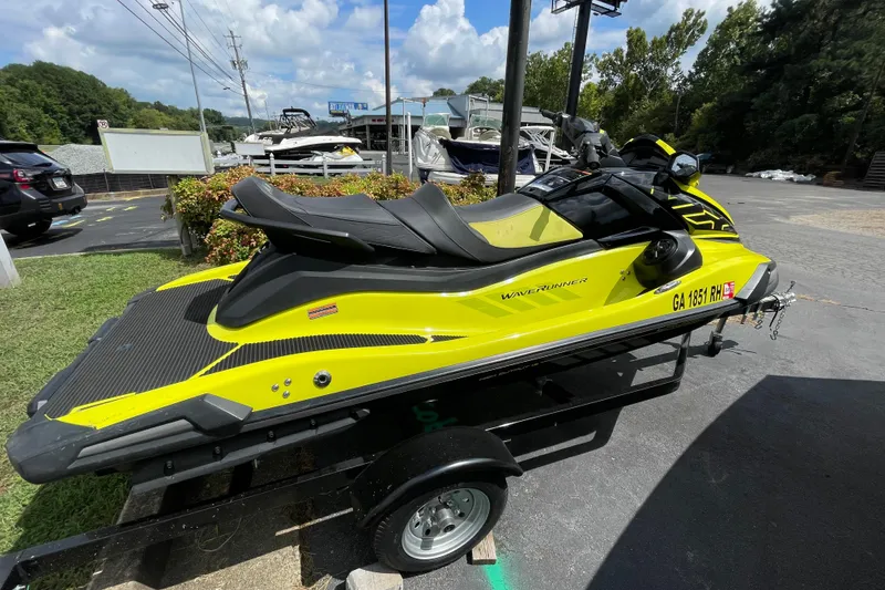 Slide: The Image of 2021 Yamaha WaveRunner VX Cruiser HO in vibrant yellow on a trailer. - 2