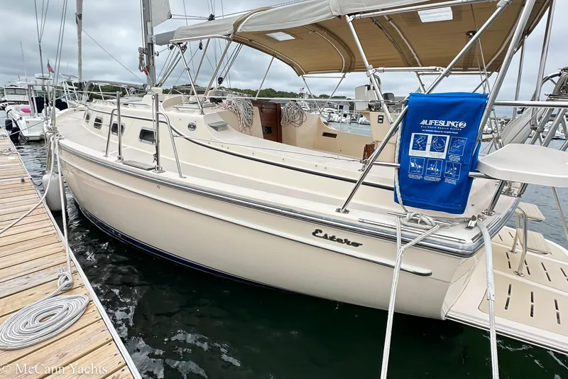 Slide: The Image of 2010 Island Packet Estero yacht docked, featuring a Lifesling safety device. - 11