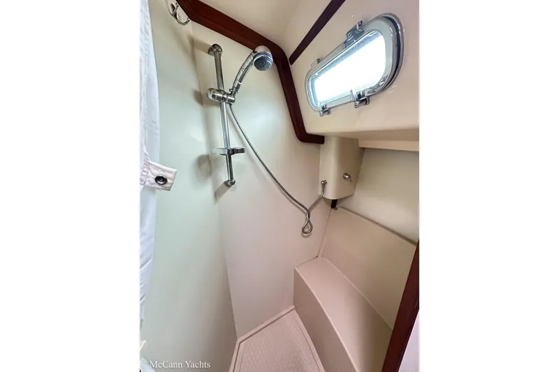 Slide: The Image of 2010 Island Packet Estero yacht shower with window and chrome fixtures. - 24