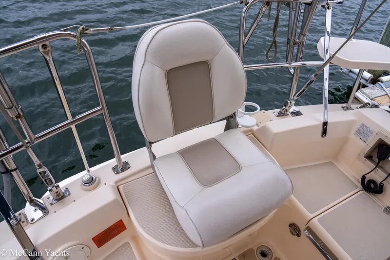 Slide: The Image of Captain's chair on 2010 Island Packet Estero yacht, overlooking water. - 3