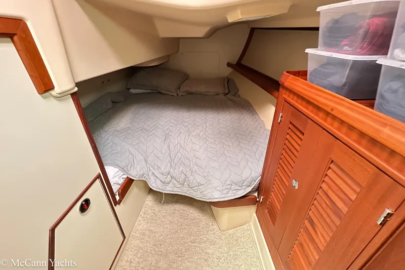 Slide: The Image of Cozy cabin interior of 2010 Island Packet Estero yacht with bed and storage. - 32