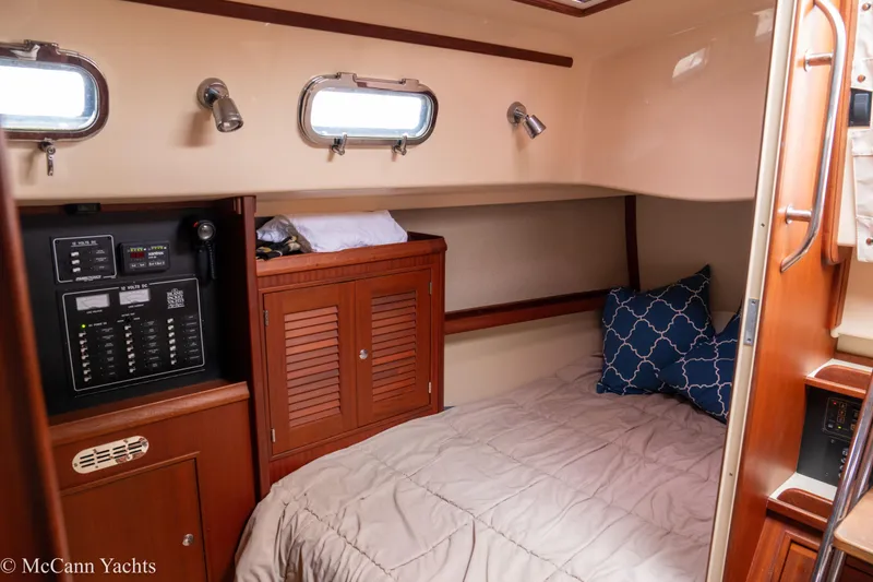 Slide: The Image of Cozy cabin interior of 2010 Island Packet Estero yacht with bed and control panel. - 41