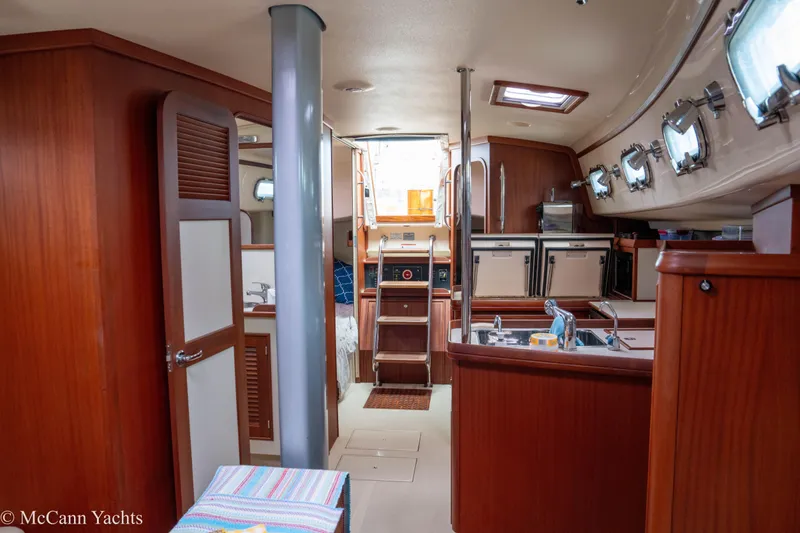 Slide: The Image of Interior of 2010 Island Packet Estero yacht with wooden cabinetry and modern amenities. - 44