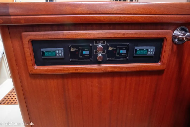 Slide: The Image of Control panel on 2010 Island Packet Estero yacht with digital displays and switches. - 45