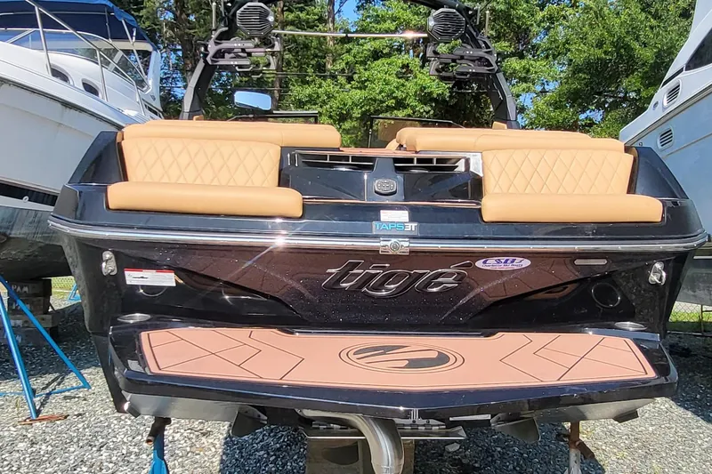 Slide: The Image of 2023 Tigé Z3 boat with tan seating and sleek black exterior. - 10