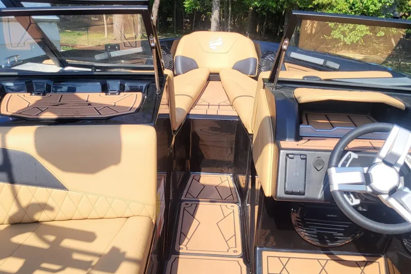Slide: The Image of 2023 Tigé Z3 boat interior with tan leather seats and modern steering wheel. - 22