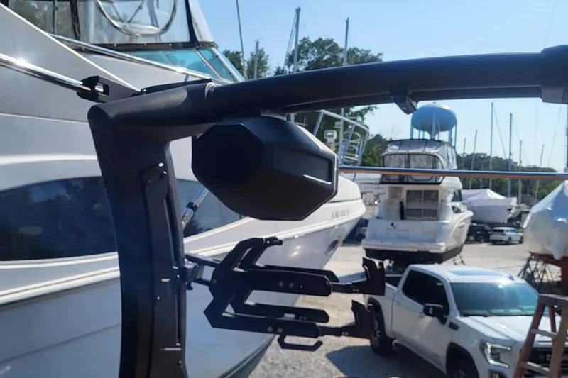 Slide: The Image of 2023 Tigé Z3 boat with wakeboard tower in a marina setting. - 4