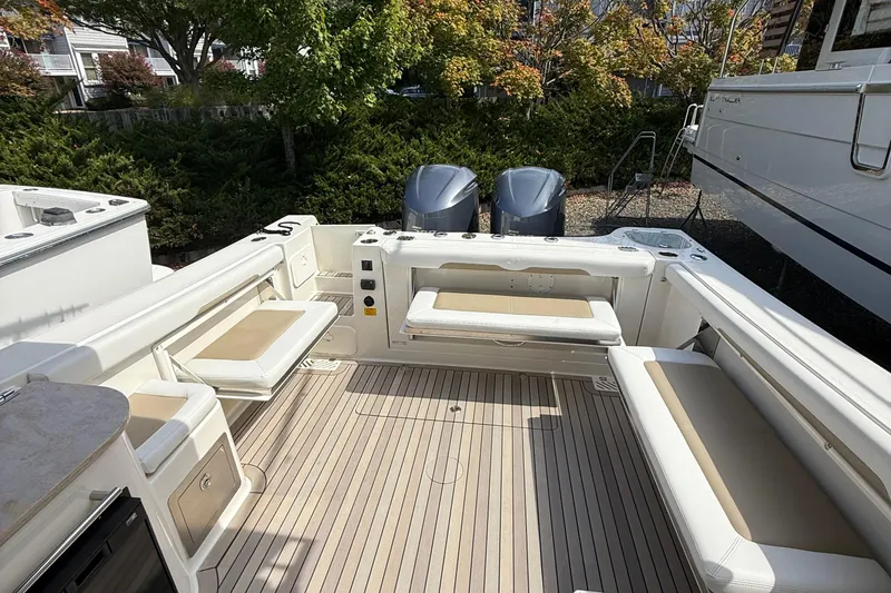 Slide: The Image of 2016 Sailfish 325 DC boat interior with seating and twin engines. - 10
