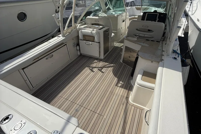 Slide: The Image of 2016 Sailfish 325 DC boat interior with spacious deck and seating area. - 15