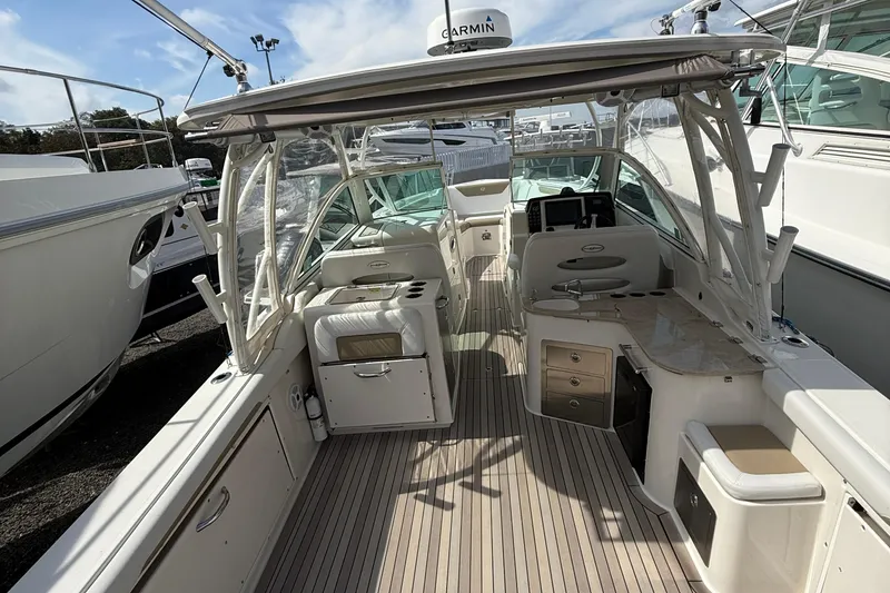 Slide: The Image of 2016 Sailfish 325 DC boat interior with seating, storage, and navigation equipment. - 16