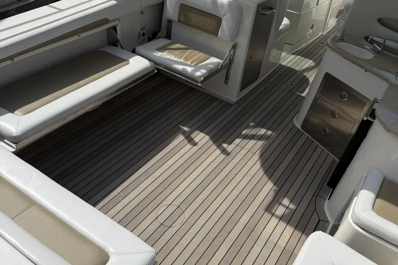 Slide: The Image of Spacious deck of 2016 Sailfish 325 DC boat with cushioned seating and storage. - 2