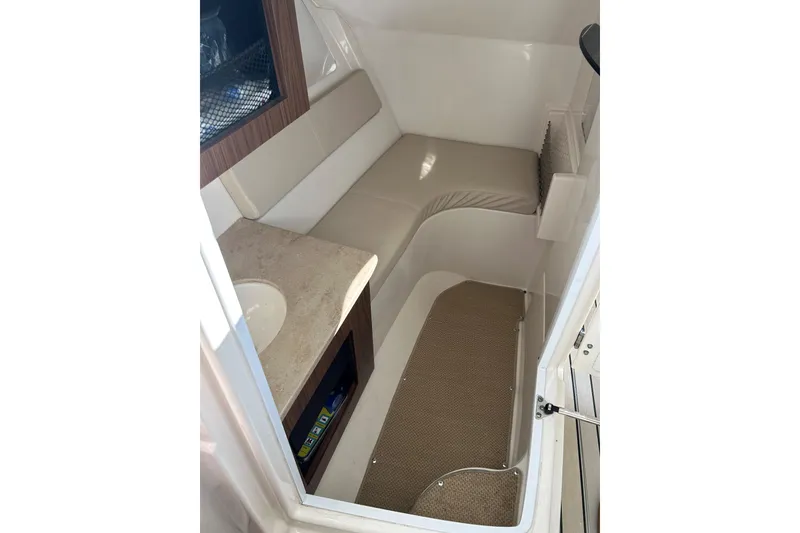 Slide: The Image of Interior cabin of 2016 Sailfish 325 DC boat with seating and sink. - 20