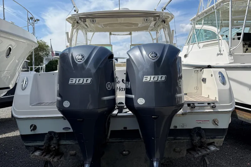 Slide: The Image of 2016 Sailfish 325 DC boat with dual Yamaha 300 outboard engines. - 23