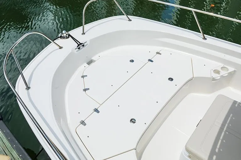 Slide: The Image of 2026 Boston Whaler 190 Montauk boat interior with cushioned seating and storage. - 4