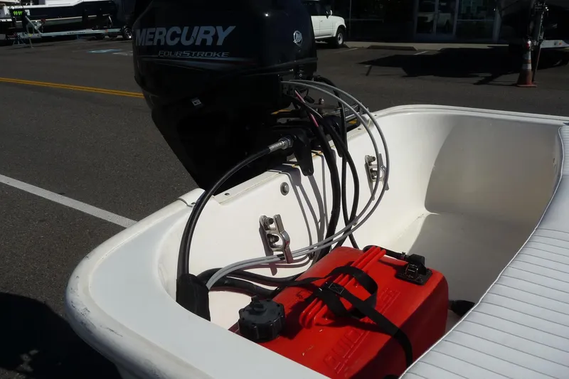 Slide: The Image of 2018 Boston Whaler 110 Sport boat with Mercury FourStroke engine and red fuel tank. - 5