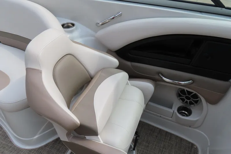 Slide: The Image of 2019 C 285ss boat interior with beige and white seating, cup holder, and speaker. - 13