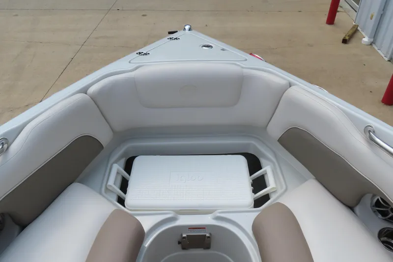 Slide: The Image of 2019 C 285ss boat interior with white seating and Igloo cooler. - 16