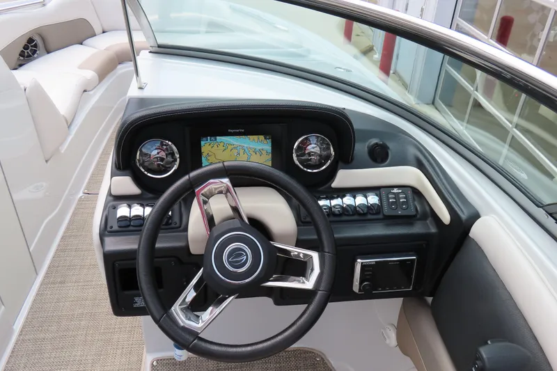 Slide: The Image of 2019 C 285ss boat dashboard with steering wheel and navigation display. - 18