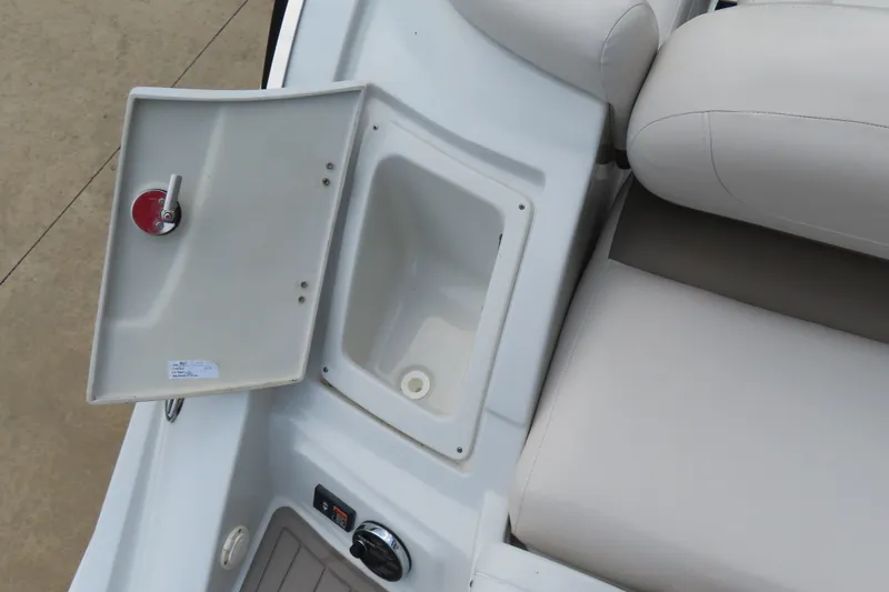 Slide: The Image of 2019 C 285ss boat interior with open storage compartment and beige seating. - 25