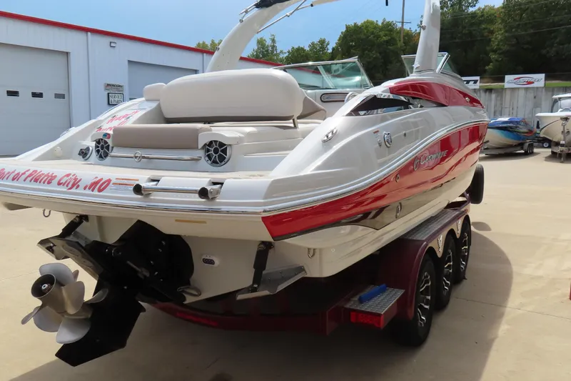 Slide: The Image of 2019 C 285ss boat with red and white design on a trailer at a marina. - 6