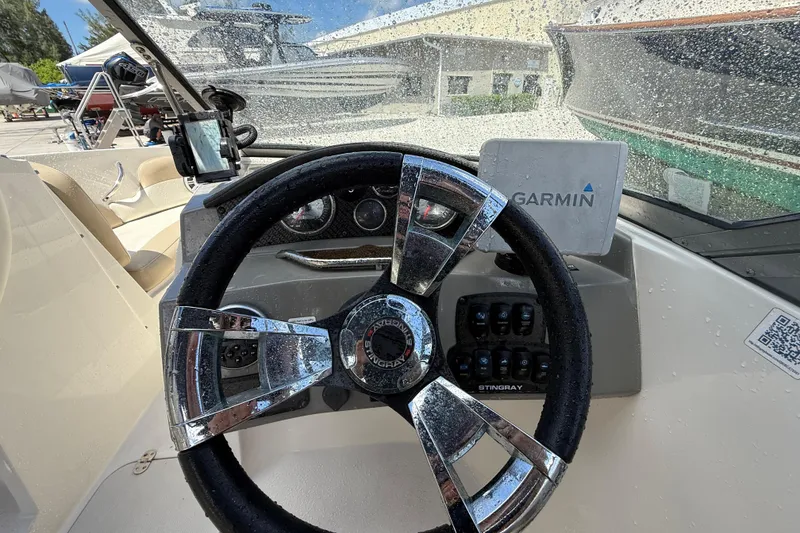 Slide: The Image of Steering wheel of 2017 Stingray 204 LR boat with Garmin navigation system. - 14