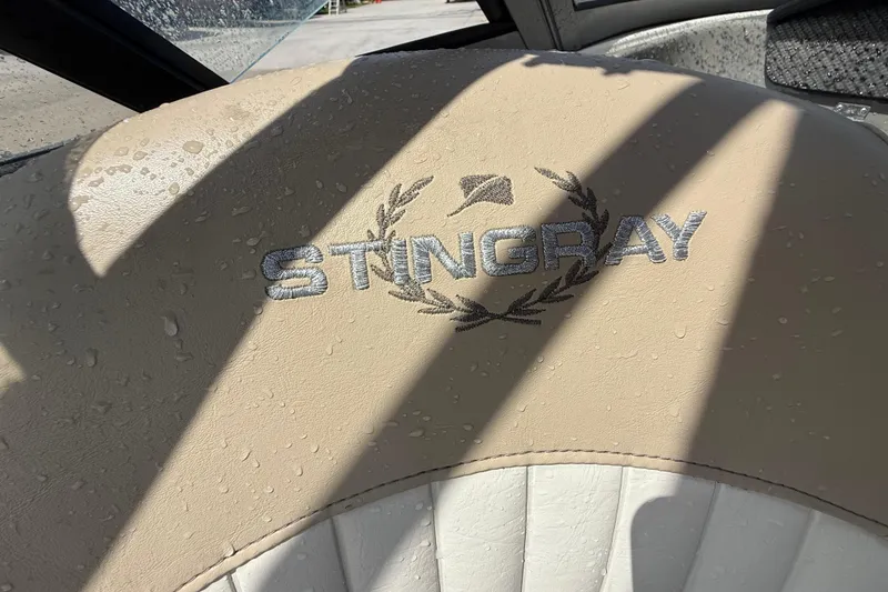 Slide: The Image of Beige Stingray 204 LR 2017 boat seat with embroidered logo and water droplets. - 20