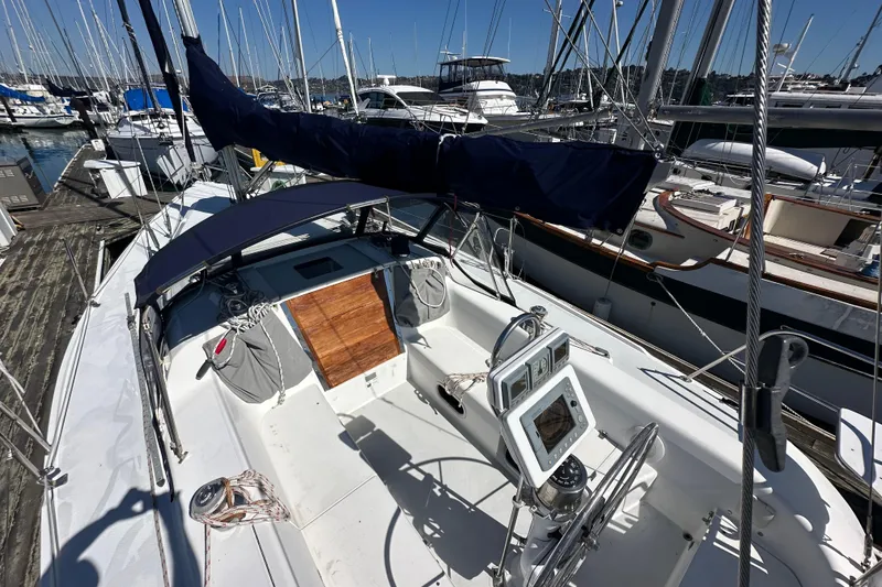 Slide: The Image of Sailboat Catalina 320, 2000 model, docked at marina with clear blue sky. - 2