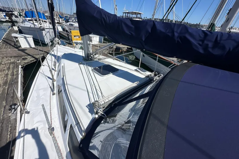 Slide: The Image of Sailboat docked at marina, Catalina 320 model, year 2000, with blue sail cover. - 4