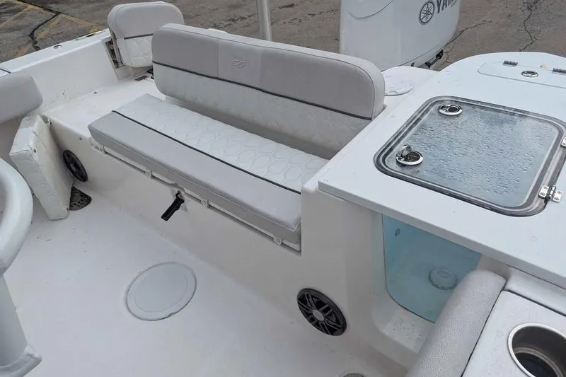 Slide: The Image of 2024 Sea Fox 228 Commander boat interior with seating and storage compartments. - 12