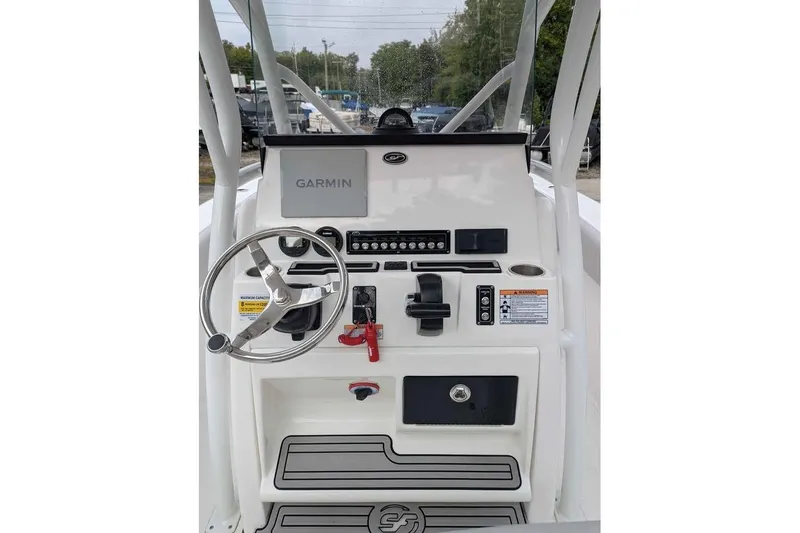 Slide: The Image of 2024 Sea Fox 228 Commander boat console with Garmin navigation system and steering wheel. - 7