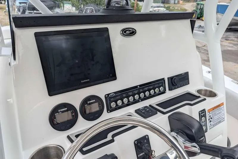 Slide: The Image of 2024 Sea Fox 228 Commander dashboard with Garmin display and Yamaha gauges. - 8