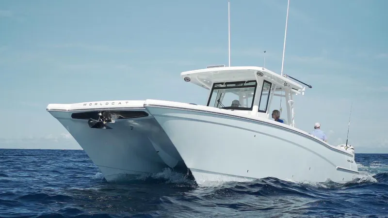 Slide: The Image of 2026 World Cat 400CC-X boat cruising on open ocean waters. - 11