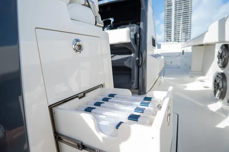 Slide: The Image of 2026 World Cat 400CC-X boat with open storage compartment and modern design. - 12