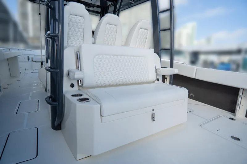 Slide: The Image of Luxury seating on 2026 World Cat 400CC-X boat, featuring elegant white upholstery. - 13
