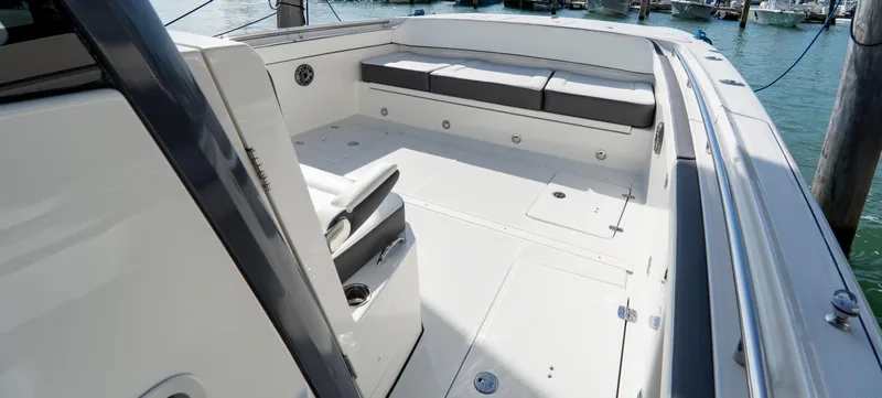 Slide: The Image of 2026 World Cat 400CC-X boat interior with spacious seating and sleek design. - 18