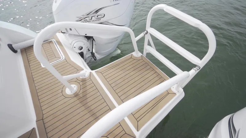Slide: The Image of Swim platform on 2026 World Cat 400CC-X boat with outboard motor. - 22