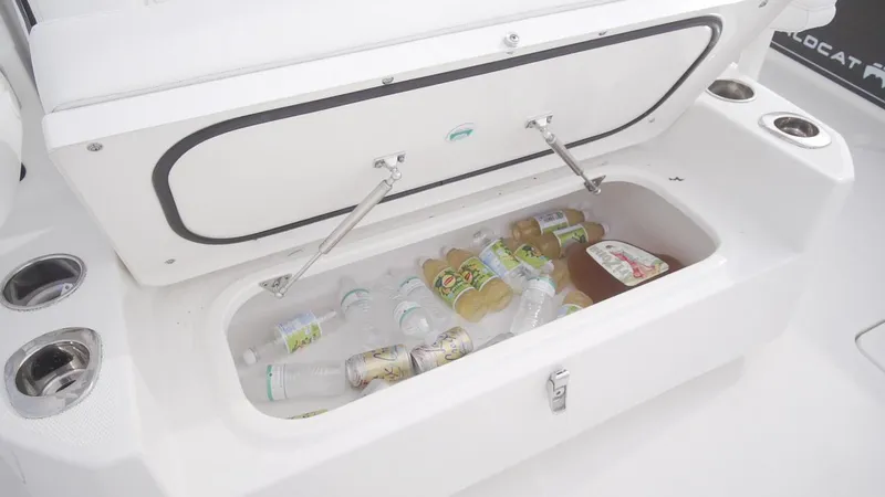 Slide: The Image of Built-in cooler on 2026 World Cat 400CC-X boat, stocked with drinks and ice. - 35