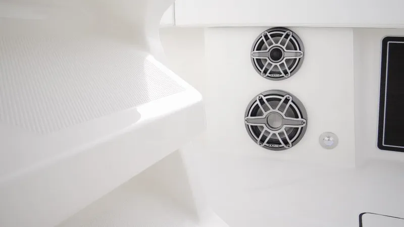 Slide: The Image of Interior of 2026 World Cat 400CC-X boat with dual speakers and sleek design. - 38