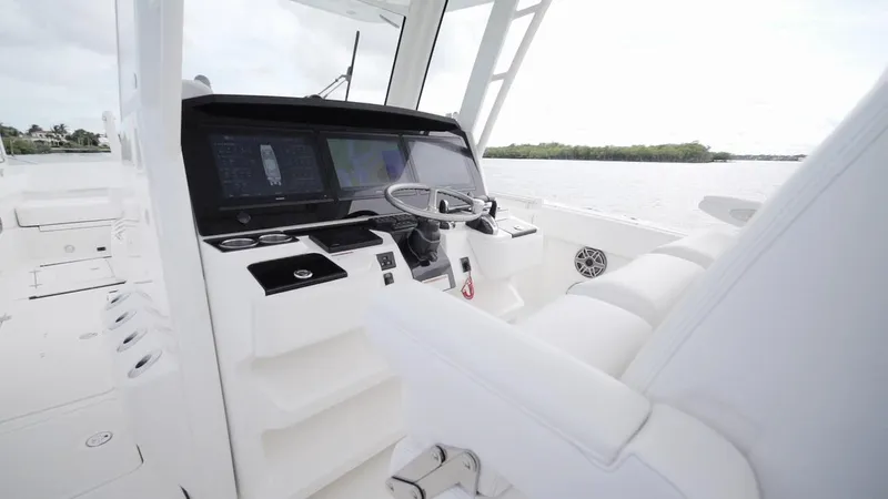 Slide: The Image of 2026 World Cat 400CC-X boat interior with modern helm and sleek white seating. - 40