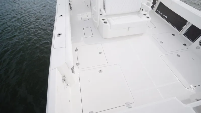 Slide: The Image of 2026 World Cat 400CC-X boat deck, spacious and sleek design on water. - 45