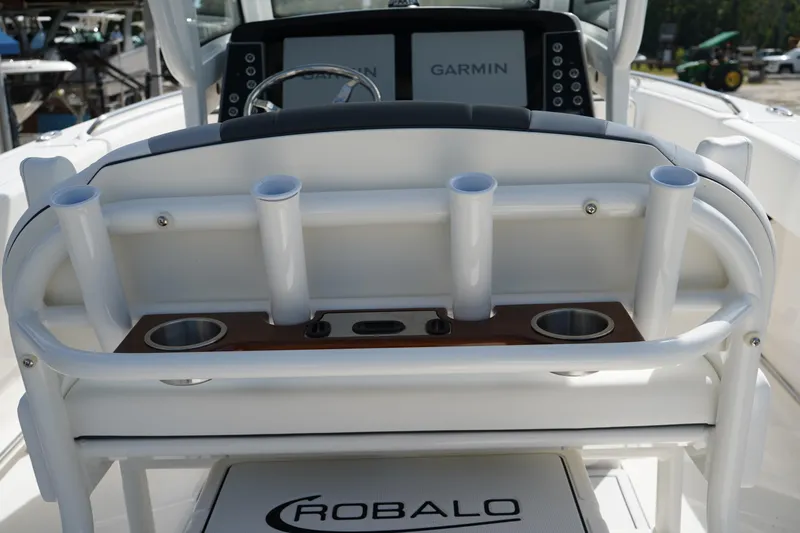 Slide: The Image of 2026 Robalo R250 Center Console boat with rod holders and Garmin navigation system. - 16