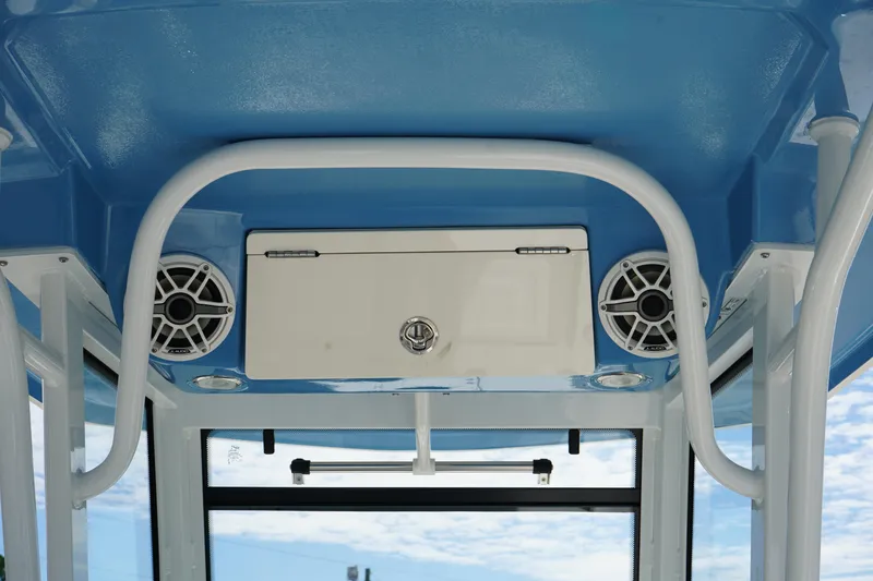 Slide: The Image of 2026 Robalo R250 Center Console boat interior with speakers and storage compartment. - 18