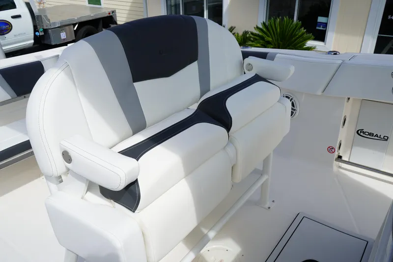 Slide: The Image of 2026 Robalo R250 Center Console boat seating with white and gray upholstery. - 21