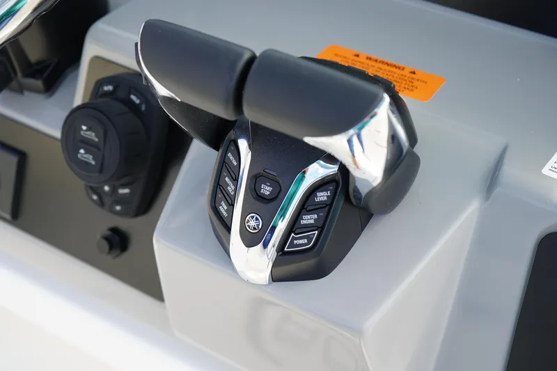 Slide: The Image of Throttle controls on 2026 Robalo R250 Center Console boat dashboard. - 27