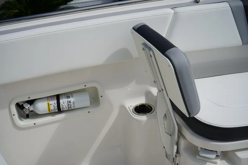 Slide: The Image of 2026 Robalo R250 Center Console boat interior with fire extinguisher and seating. - 39