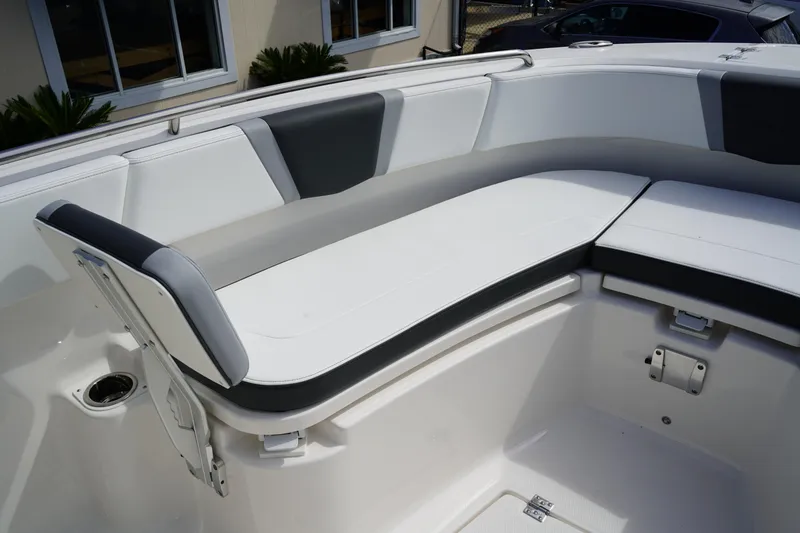 Slide: The Image of 2026 Robalo R250 Center Console boat with cushioned seating in white and gray. - 42
