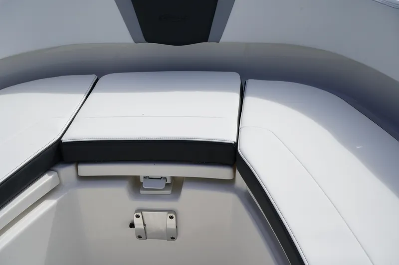 Slide: The Image of 2026 Robalo R250 Center Console boat seating area with white cushions. - 43