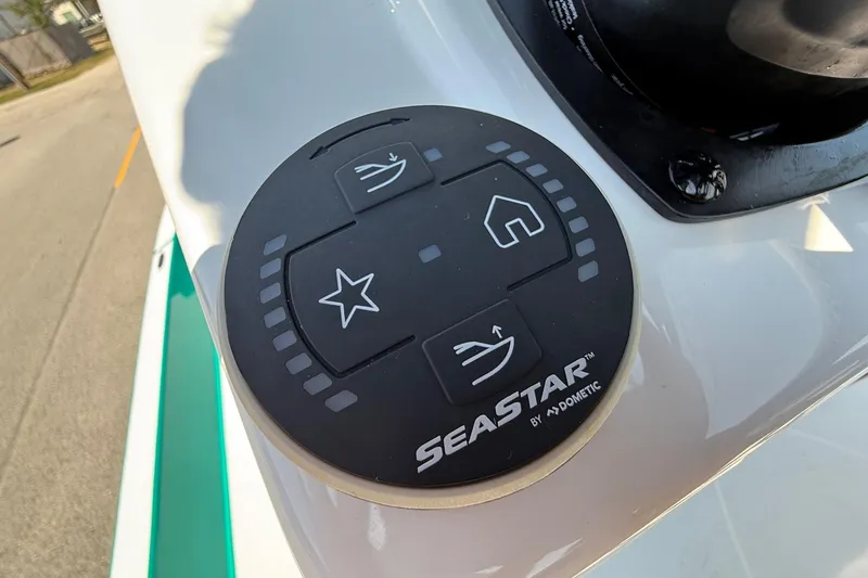 Slide: The Image of Control panel on a 2026 SCB R24 boat featuring SeaStar by Dometic. - 17