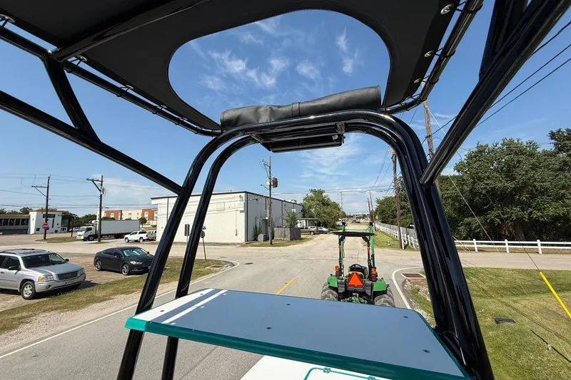 Slide: The Image of Rooftop view from SCB R24, 2026 model, overlooking a street with vehicles and buildings. - 19